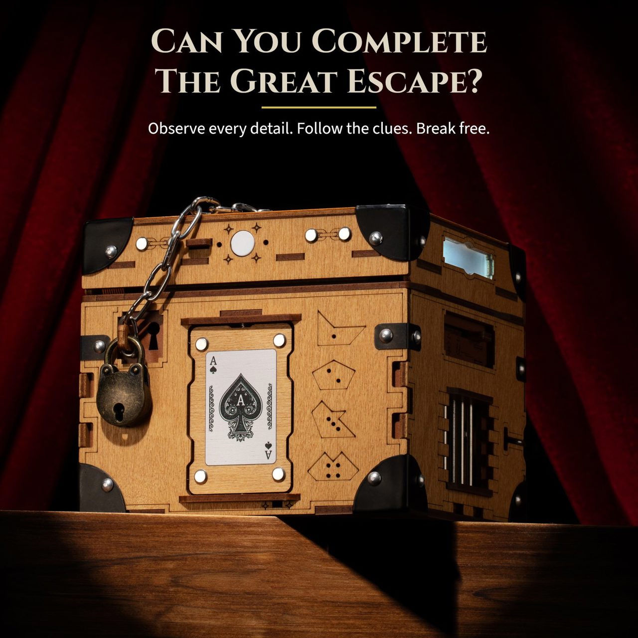 Can you complete the great escape? Observe every detail, follow the clues, break free. The box lit against red theatre curtains.